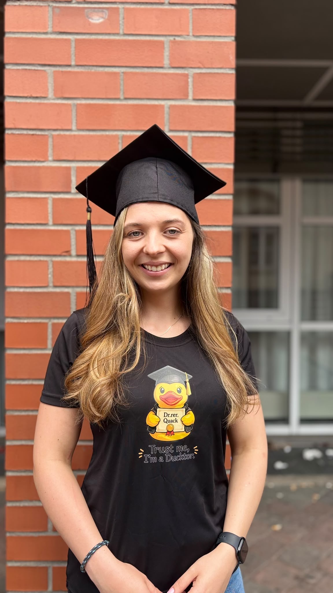 Anna-Lena wearing a PhD party hat